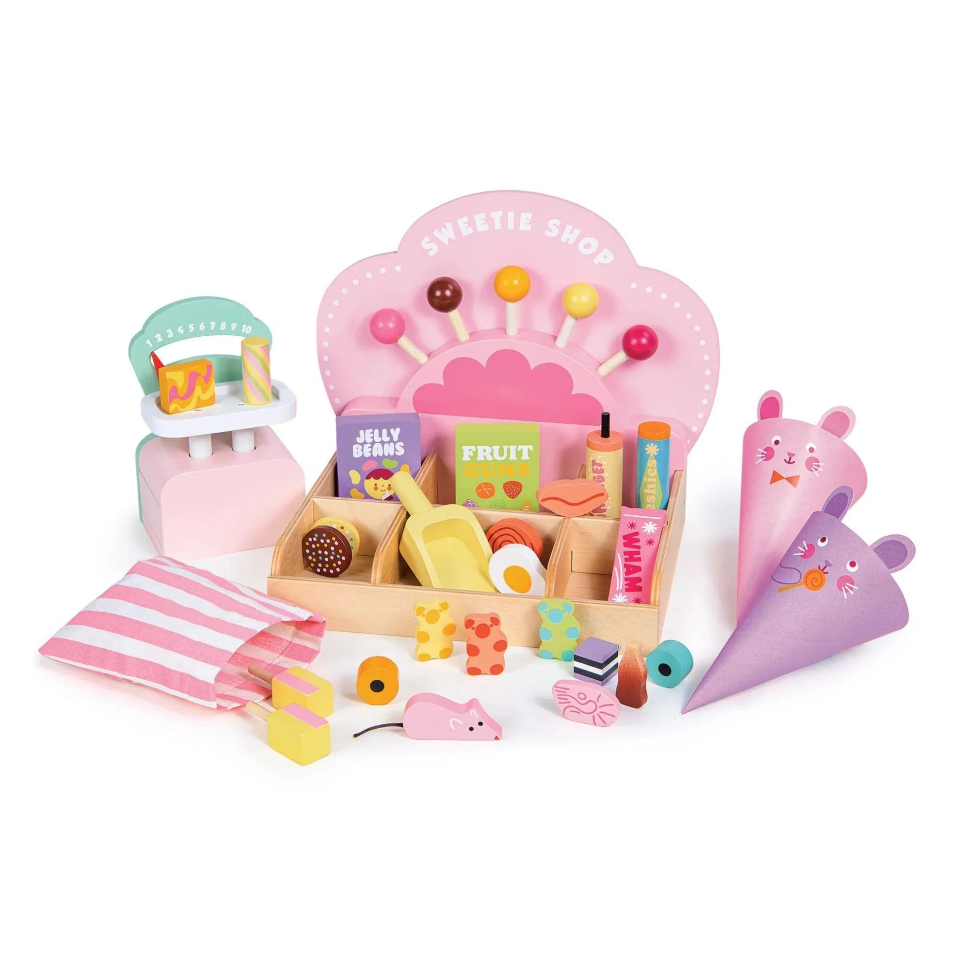 Toy sweet shop set with various items on a white background
